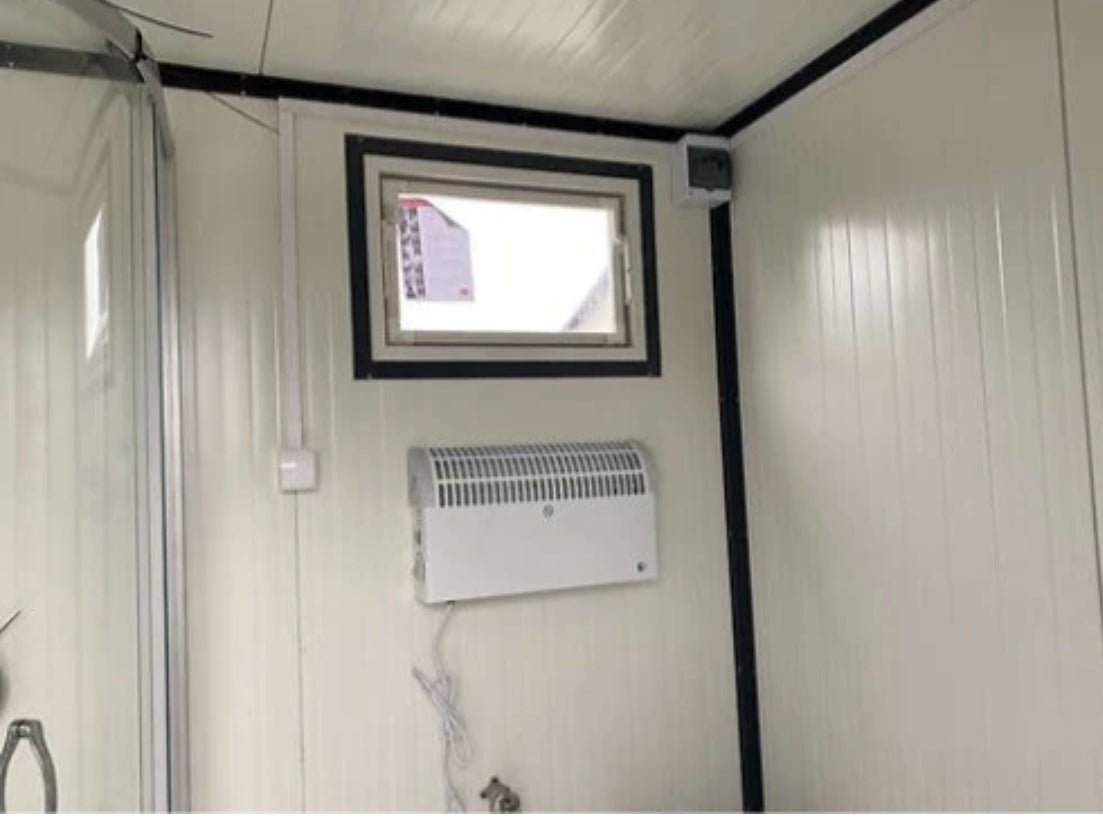 Contenedor sanitario de 4x2 m con inodoro doble y ducha